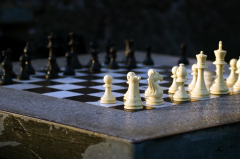 chess pieces on concrete table